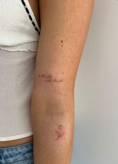 a woman with a small tattoo on her arm