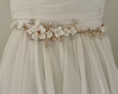 Floral Bridal Belt, Elegant Bridal Belt With Flower Decoration For Wedding, Elegant Bridal Belt With Handmade Flowers For Weddings, Elegant Bridal Belt With Flower Decoration, Delicate Floral Bridal Accessories For Wedding, Elegant Bridal Belt With Handmade Flowers, Handmade White Bridal Accessories With Flowers, White Bridal Accessories With Sashes, White Embellished Sashes For Wedding