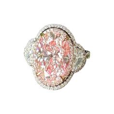 a fancy ring with pink and white diamonds