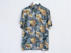 "UNCLE ED PRESENTS - vintage short sleeved printed shirt - 1 pocket - materials: 100% viscose CONDITION (1-10 ❶❷❸❹❺❻❼❽❾ Great condition SIZE/MEASUREMENTS size from label: 42/43 best fits men: M/L chest: 45,5 inches (116 cm) length: 29 inches (74 cm) The model is 6'1\" (186 cm), measures 41-35-39 (104-88-100 cm) and wears size L" Patterned Short Sleeve Shirt With All Over Print, Short Sleeve Retro Print Camp Shirt For Summer, Retro Print Short Sleeve Camp Shirt For Summer, Summer Camp Shirt With Vintage Print And Short Sleeves, Casual Tops With Abstract Pattern And Short Sleeve, Short Sleeve Tops With Abstract Pattern For Summer, Summer Short Sleeve Camp Shirt With Vintage Print, Patterned Short Sleeve Hawaiian Shirt With Graphic Print, Summer Tops With Abstract Pattern And Short Sleeves