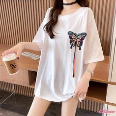 Qteee - Elegantly Embroidered Round Collar T-Shirt with Butterfly Design White Floral Embroidered T-shirt, White Floral Embroidered Short Sleeve T-shirt, White Floral Embroidery Short Sleeve T-shirt, White Short Sleeve T-shirt With Floral Embroidery, White Embroidered T-shirt For Summer, White Crew Neck Top With Floral Embroidery, White Floral Embroidered Short Sleeve Top, White Floral Embroidery Short Sleeve Top, Casual White Top With Floral Embroidery