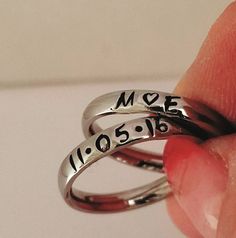 "These Stainless Steel rings are super shiny and a petite 3 mm wide, with a rounded edge. The letters y, p, and j do NOT do well on this rounded ring therefore I suggest if you have these letters in your name that you order the 3 mm flat ring available on my page. These rings are comfortable for stacking up to 4 rings. I can personalize with names, dates, quotes or roman numerals or scripture. Great to wear with your diamond or use as a thumb ring also. These rings also come in Gold and Rose Gol Personalized Adjustable Open Midi Rings, Custom Name Adjustable Open Ring, Dainty Personalized Initial Ring With Round Band, Personalized Dainty Initial Ring, Dainty Personalized Initial Ring, Adjustable Personalized Stackable Rings, Elegant Promise Rings With Hand Stamping, Elegant Hand Stamped Promise Rings, Personalized Adjustable Open Ring