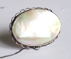 Beautiful mother of pearl brooch set in white metal surround with safety chain attached. Ready to wear vintage condition. Approx 4.5 cm long with a secure catch. Item will be carefully wrapped and packaged in an organza gift bag and posted within 2 working days.. Paris Souvenirs, Ski Gifts, Vintage Dragonfly, Vintage Paris, Pearl Brooch, Silver Brooch, Organza Gift Bags, Agate Stone, White Metal