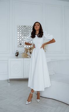 Fabric: Crepe Viscose 50%, Polyester 40%, Elastane 10% Round neckline Puff sleeves Short sleeves Backless dress Midi length Colors: White Confirmation Dresses, White Wardrobe, Chic And Elegant, White Midi, Puff Sleeve Dresses, Red Sky, Crop Top Shirts, Reception Dress, Dress Midi