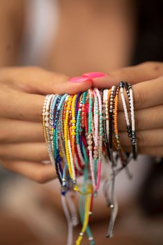 These bracelets are so cute and colorful, sure to give a pop of color to any look. They give a boho vibe and look great dressed up or down. Stack or wear alone. We have so many cute styles, and they makes the perfect gift! Details:       12 styles     Each stack comes with 3 rows of beads     Size is adjustable (7" - 9")     Materials:     Nylon with beads Trendy Tiny Beads Wrap Bracelet Gift, Trendy Adjustable Beaded Bracelet, Colorful Tiny Beads Jewelry For Friendship, Everyday Braided Bracelets With Tiny Beads, Everyday Tiny Beads Braided Bracelet, Bohemian Hand Wrapped Bracelets For Party, Trendy Hand-strung Jewelry For Festivals, Trendy Adjustable Beaded Braided Bracelets, Adjustable Beaded Colorful Bracelets