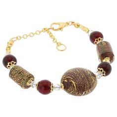 This gorgeous Venetian bracelet in classic Venetian palette of red and gold is a unique piece of jewelry created for the discerning woman by the famous Murano glass masters in their tradition of artistic elegance and exquisite workmanship. It is 100% handcrafted using centuries-old original Murano Glass techniques. This Murano Glass bracelet features beautiful red color that will never fade, and a combination of original Murano beads infused with 24K gold foil for a look which evokes the unique Gold Glass Beaded Bracelets, Luxury Red Beaded Bracelets, Classic Red Bangle Jewelry, Elegant Red Beaded Bangle Bracelet, Elegant Red Bracelet For Gift, Traditional Murano Glass Jewelry Gift, Elegant Red Round Bead Bracelets, Elegant Red Round Beaded Bracelets, Elegant Red Gold Bangle Bracelet