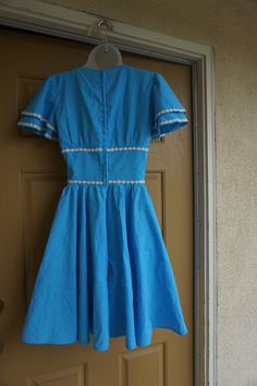 "Vintage 1950s dress with back metal zipper. Size estimated 6. Please see measurements. Good vintage condition! Measurements taken across front laid flat 17\" across front armpit to armpit 13\" across front of waist 35\" length" Retro Vintage Dress With Fitted Bodice, Fitted A-line Rockabilly Vintage Dress, Lined Retro Vintage Dress For Vintage Fashion, Lined Vintage Dress In Retro Style, Retro Vintage Dress Tea Length, Retro Dress With Lined Fitted Waist, Retro Tea-length Lined Vintage Dress, Retro Lined Tea-length Vintage Dress, Retro Vintage Tea-length Dress