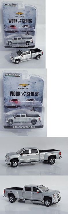 two model trucks are shown side by side in the same package, one is silver and the other is black