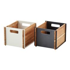 two wooden bins with handles on each side and one holding a black and white box