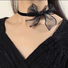 This Lovely Ribbon Bow Choker Is A Wonderful Addition To Your Wardrobe And Your! Unique And Sure To Get Lots Of Compliments! Black Bow Necklace, Pearl Ribbon Necklace, Ribbon Choker Outfit, Ribbon Around Neck, Choker Outfit, Gothic Coquette, Ribbon Fashion, Bow Choker, Silhouette Necklace