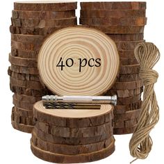 a stack of wooden logs with the words 40 pcs on it and a ball of twine next to them