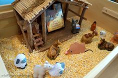 a nativity scene with animals and a manger