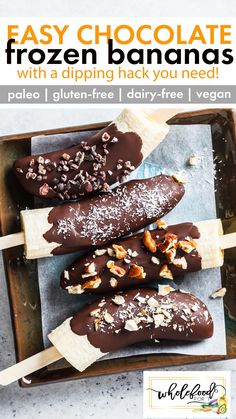 chocolate frozen bananas on a tray with nuts