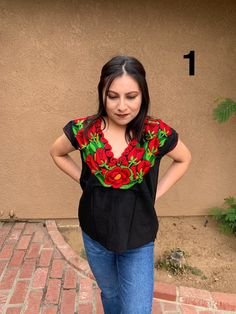 Beautiful Mexican Top that is full of embroidered florals that will make you stand out at any event. This blouse is embroidered by artisanal machine in the State of Puebla and is completely one of a kind! Each blouse is unique in its own way. Size: Small/Medium Multicolor Embroidered Floral Print Short Sleeve Blouse, Short Sleeve Floral Embroidered Festival Top, Festival Floral Embroidered Short Sleeve Top, Festival Short Sleeve Embroidered Top, Festival Short Sleeve Top With Embroidered Neckline, Festival Embroidered Top With Short Sleeves, Festival Embroidered Neckline Top With Short Sleeves, Short Sleeve Tops With Embroidered Neckline For Festivals, Fitted Embroidered Top With Floral Print And Short Sleeves