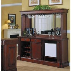 a large wooden cabinet with wine glasses on it