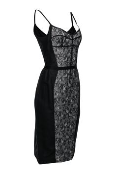 Look sultry and feel luxurious with this Dolce & Gabbana fitted dress. This dress flatters your shape with princess seam lines outlining a classic lace middle. Pair this with sky-high pumps and a mini bag for an elevated LBD look! Size 10 (IT 46) Shell: 50% Polyamide, 35% Cotton, 15% Silk Lining: 100% Silk Sleeveless Exposed back zipper Fully lined Soft sweetheart neckline Bust 36" Waist 30.5" Shoulder to hem 43" Fitted Lace Dress With Lined Bodice, Elegant Fitted Corset Dress With Lace Bodice, Classic Sleeveless Gala Dress, Formal Spaghetti Strap Dress With Contrast Lace, Elegant Lace Dress With Corset Back And Sweetheart Neckline, Elegant Fitted Corset Dress With Lace Trim, Sleeveless Lace Dress With Fitted Bodice For Evening, Sleeveless Lace Dress With Fitted Bodice For Cocktail, Evening Sleeveless Lace Dress With Fitted Bodice