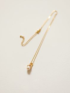 Details Our Pearl Drop Necklace is an essential piece to the minimalist's jewelry collection. It features a single freshwater rice pearl suspended on a dainty chain. Delicate & comfortable, you'll forget it's even there. Easy to layer with your other favorites! Necklace length: 16" with 2" extender 18k gold plated copper with freshwater pearl Shipping & Return Free US shipping on orders over $100.Free International shipping on orders over $300. For more details click HERE. Minimalist Everyday Charm Necklace With Pearl Chain, Minimalist Everyday Pearl Necklace With Round Pendant, Dainty Pearl Pendant Charm Necklace For Everyday, Everyday Pearl Charm Necklace With Adjustable Chain, Dainty Pearl Pendant Charm Necklace, Minimalist Pearl Pendant Charm Necklace For Everyday, Minimalist Pearl Pendant Necklace For Everyday, Minimalist Pearl Pendant Charm Necklaces, Minimalist Everyday Necklace With Pearl Pendant