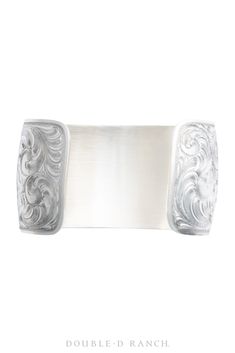 SLEEK SCROLLED STACKER BY SHAWNA ERICKSON. This classic contemporary cuff is a bold wide band of sterling silver elegantly engraved with intricate Western scrollwork. It’s timeless and traditional with subtle southwestern charm, a beautiful piece that’s perfect as a solo statement piece or for adding some substance and shine to your stack. artist: Shawna Erickson materials: sterling silver measurements: 6 1/8" inside, 1 1/4" gap, 1 1/2" across face weight: 75 grams contemporary style: JB3304 in Elegant Stamped Cuff Bracelet, Elegant Engraved Cuff Bracelet For Formal Occasions, Elegant Engraved Cuff Bracelet For Formal, Elegant Stamped Cuff Bracelet For Wedding, Formal Stamped Cuff Jewelry, Elegant Formal Cuff Bracelet With Etched Details, Elegant Etched Cuff Bracelet For Formal Occasions, Elegant Stamped Silver Cuff Bracelet, Elegant Etched Cuff Bracelet