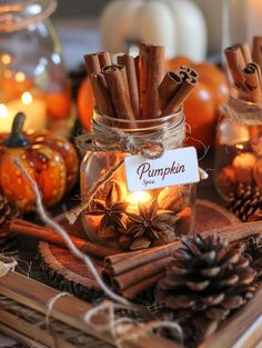 some cinnamon sticks are in a glass jar with a label that says pumpkin on it