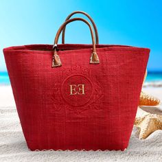 This elegant beach bag is made by Le Comptoir De LA Plage -  Franch well known company since 1999 - entirely made by hand in Madagascar, from Raffia, with leather handles. You can choose 1 of 4 frames (see picture 2). Dual carrying handles 19"W x 12.5"H x 6"D Flat base Accent stitching on bottom Entirely hand made from natural fibers 100%  Authentic  Personalized by request with Monogram or Name Colors available: - natural with green border -natural with red border - pink - red - yellow - turquo Rectangular Summer Pool Bag, Red Straw Shopping Bag, Red Rectangular Straw Bag For Daily Use, Red Rectangular Straw Bag For Shopping, Red Rectangular Straw Shopping Bag, Rectangular Red Straw Bag For Shopping, Red Large Capacity Beach Bag For Vacation, Rectangular Red Straw Shopping Bag, Large Capacity Red Beach Bag For Vacation