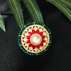 Jaipuri Ruby Emerald Kundan Ring / Emerald Amrapali Rajwadi Ring / Sabyasachi Ring /Statement Indian Wedding Ring / Pakistani Jewelry Made in Brass with very Kundan, Ruby and Emerald Green Semi-precious stones Handmade Meenakari, Kundan Jadau Statement Ring Width: 1 Inches Adjustable Ring Lightweight Jewelry Suitable for any traditional or contemporary occasion High quality and craftsmanship. Facebook: www.facebook.com/shoparyafashions Pinterest: www.pinterest.com/aryafashions Instagram: www.ins Temple Jewelry Style Ceremonial Tikka, Round Cutdana Jewelry For Puja, Round Meenakari Tikka As Gift, Fusion Style Jewelry For Wedding And Navratri, Ceremonial Round Tikka With Tilla Detail, Ceremonial Round Tikka With Tilla, Traditional Round Tikka For Wedding, Traditional Rings For Puja And Festivals, Round Tilla Rings For Wedding