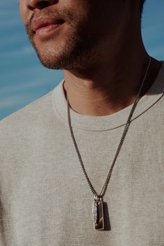 Crafted for the modern spirit, this sterling silver rounded box chain boasts a striking Tiger's Eye tag pendant that represents strength and confidence. Paired with a sleek silver feather charm, this necklace is an everyday piece you'll never take off. Sterling Silver Tiger's Eye 2.5mm Chain Thickness 22"-26" Length (24” pictured) Pendants and Chain sold together Tiger's Eye: Protection, Courage, Balance, Clarity Pearl Jewelry Gift, Picture Pendant, Feather Necklace, Feather Charms, Silver Feather, Stacked Jewelry, Feather Necklaces, Tiger's Eye, Gold Collection