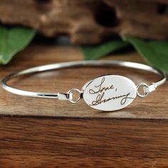 Actual Handwriting Bangle Bracelet, Memorial Bracelet, Sympathy Gift, Personalized Engraved Bracelet, Gift for Her, Signature Bracelet This laser engraved Stainless Steel bangle bracelet is a perfect gift for your Mom, Best Friend or Bride or Bridesmaids! or anyone you choose! Personalized with actual handwriting. This is engraved into high quality heavy gauge stainless steel. Engravable Portion: 15mm x 24mm Stainless Steel does NOT tarnish. How to order: 1. Add this item to your shopping cart 2 Meaningful Engraved Bracelet Jewelry, Engraved Bangle Bracelets For Gifts, Adjustable Sterling Silver Jewelry With Engraved Text, Adjustable Symbolic Jewelry With Engraving Option, Adjustable Oval Bracelet For Gift, Adjustable Oval Bracelets As Gift, Personalized Spiritual Bangle Bracelet, Engraved Adjustable Oval Bracelets, Adjustable Oval Engraved Bracelets