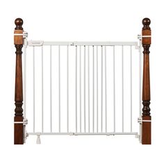 a baby gate with wooden posts and white rails