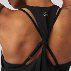 Lightweight, Flowy Tank Twisted, Racerback Detail Designed & Uniquely Fit To Flatter Every Size Wear-Tested By Our In-House Team For The Perfect Fit Alo Yoga Black Activewear With Built-in Bra, Black Tank Top With Built-in Bra And Strappy Back, Black Top With Built-in Bra And Strappy Back, Black Tops With Built-in Bra And Strappy Back, Alo Yoga Sleeveless Summer Tank Top, Alo Yoga Sleeveless Tank Top For Summer, Alo Yoga Summer Sleeveless Tank Top, Black Cross Back Athleisure Top, Black Tank Top With Adjustable Straps For Workout