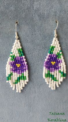 These handmade unique earrings with abstract floral print are made of high-quality Czech beads and strong synthetic thread. I use my author's scheme . They are elegant, fashionable, and highly versatile, suitable for everyday wear. Color: white,purple,yellow, green. 100% hand made with love! Copy without my permission is prohibited For those who want to buy my copyright scheme for these earrings: https://www.etsy.com/uk/listing/816043233/brick-stitch-pattern-for-seed-bead?ref=shop_home_active_1 Hypoallergenic Adjustable White Beaded Earrings, White Dangle Flower Earrings With Colorful Beads, White Flower Dangle Earrings With Colorful Beads, Handmade Purple Beaded Earrings, White Hypoallergenic Beaded Earrings As Gift, Hypoallergenic White Beaded Earrings Gift, Hypoallergenic Purple Beaded Earrings, Hypoallergenic White Beaded Earrings For Gifts, Handmade Purple Crafts For Crafting