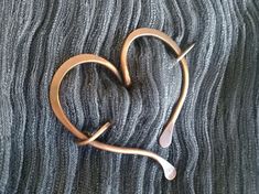 "This brooch was forged with love. It's a heart shape pennanular brooch, it's made with thick gauge solid copper wire, hammered, shaped and oxidized with love and care. It measures approx. 6cm/ 2.4\" It's perfect to hold your shawl, your scarf, to put in your collar jacket or even in your sweater. My items are 100% handmade. Each one is made in the design shown however, will have slight variations, they are made one at a time so, always unique. ### Items ready to ship in 3-5 days. Allow 2-4 week Artistic Copper Jewelry Gift, Silver Heart-shaped Copper Jewelry, Handmade Heart-shaped Copper Necklaces, Copper Leaf-shaped Jewelry Gift, How To Clean Silverware, Copper Shawl Pin, Sweater Pin, Wire Wrapped Stone Jewelry, Simple Sweaters