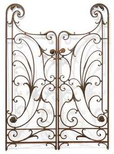 an ornate iron gate with scrolls and flowers on the sides, set against a white background