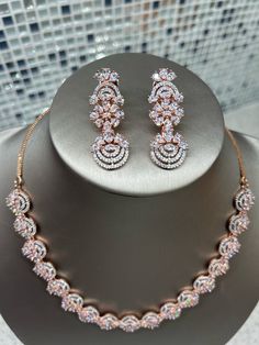 This unique rose gold necklace and earrings set is one of its kind. The craftsmanship is gorgeous and you won't find this set anywhere but Drama Queen Jewelz Gorgeous and unique with this gorgeous circular motif! Earrings can be worn alone as well! Pink Gold Diamond Jewelry For Party, Rose Gold Elegant Jewelry With Cubic Zirconia, Rose Gold Cubic Zirconia Jewelry With Elegant Design, Rose Gold Wedding Jewelry With Diamond Accents, Rose Gold Wedding Jewelry Sets With Diamond Accents, Handmade Rose Gold Jewelry For Anniversary, Pink Gold Diamond Party Jewelry, Rose Gold Cubic Zirconia Jewelry For Wedding, Hand Set Rose Gold Jewelry Sets For Wedding