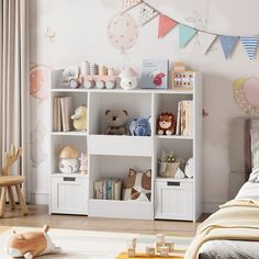 a child's room with toys and decorations on the shelves, including a teddy bear