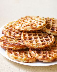 waffles stacked on top of each other on a white plate