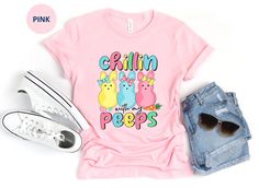 This cute Chillin with My Peeps Easter T Shirt is great for Easter day, spring or anytime you want to chill with your peeps! The design features three adorable easter bunny peeps with the words Chillin with My Peeps in pastel pink, yellow, blue and green. Purchase for yourself or anyone that loves peeps and Easter! This classic unisex jersey short sleeve tee fits like a well-loved favorite. Soft cotton and quality print make users fall in love with it over and over again. These t-shirts have-ribbed knit collars to bolster shaping. The shoulders have taping for better fit over time. Dual side seams hold the garment's shape for longer.  .: 100% Airlume combed and ringspun cotton (fiber content may vary for different colors) .: Light fabric (4.2 oz/yd² (142 g/m .: Retail fit .: Tear away labe Funny Pink T-shirt For Spring, Cute Spring Shirt With Funny Text, Cute Shirt With Funny Text For Spring, Cute Spring Tops With Funny Text, Pink Tops With Funny Text For Spring, Cute Spring T-shirt With Funny Text, Funny Print Tops For Spring, Bunny Peeps, Chillin With My Peeps