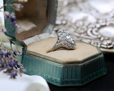 A shield ring is a remarkable piece of jewelry that embodies the elegance and artistry of the Art Deco era. Its combination of vintage diamonds, intricate filigree work, and timeless design makes it a treasured and captivating example of antique craftsmanship. Era: This ring is from the Art Deco era (1920s-1930s), known for its geometric and symmetrical designs, blending elegance with modernism. Material: The band is crafted from platinum, a precious metal known for its durability and luxurious Luxury Oval Signet Ring With Intricate Design, Luxury Signet Ring With Intricate Design For Anniversary, Heirloom Style Diamond Ring Gift, Heirloom Style Diamond Ring As A Gift, Luxury Formal Signet Ring With Intricate Design, Antique Engraved Diamond Ring Collectible, Ceremonial Silver Diamond Ring, Vintage Signet Ring With Intricate Design For Anniversary, Luxury Diamond Signet Ring Collectible