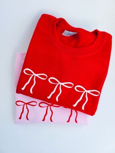 This is the cutest crewneck for every girl in their bow era! It makes a great valentines day gift 🎀 It's available in 3 different colors and 5 sizes. Message me for more sizing availability. Red Crew Neck Top For Gift, Cute Long Sleeve T-shirt As Gift, Red Long Sleeve Top For Gifts, Cute Pink Sweatshirt For Gift, Cute Pink Sweatshirt As Gift, Cute Crew Neck Sweatshirt For Gift, Cute Crew Neck Sweatshirt For Holiday, Cute Winter Sweatshirt Gift, Cute Winter Sweatshirt For Gift