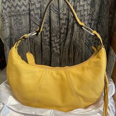 Worthington Genuine Leather Yellow Purse Shoulder Bag Hand Bag Casual Or Dressy. Side Tassell With Zipper Compartment. Inside Zipper Compartment Plus Two Inside Pockets. Yellow Lining. Lightweight. Medium Size. Condition : Fair. Although I've Never Used This Bag I Am Seeing A Few Tiny Flaws. Not Very Noticeable But Just Being Transparent. Price Reflects This. Casual Yellow Satchel Affordable, Elegant Hobo Bag With Detachable Handle For Spring, Elegant Spring Hobo Bag With Detachable Handle, Elegant Summer Crossbody Hobo Bag, Elegant Summer Hobo Bag, Summer Leather Hobo Bag, Elegant Spring Hobo Bag For Shopping, Elegant Soft Leather Bag For Spring, Elegant Yellow Shoulder Bag With Double Handle