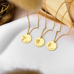 Our Personalized Birthflower Necklace is the perfect blend of elegance and sentiment. Each delicate pendant showcases a birthflower, representing the month of birth, and can be customized with a name or date. Ideal for birthdays or any special occasion, this necklace is a thoughtful and meaningful gift. Its dainty design adds a sophisticated touch to any look, making it a cherished addition to any jewelry collection. - Material: High Quality Solid 925 Sterling Silver - Dimensions: 12 mm - Finish: 14k Gold, 14k Rose Gold, 14k White Gold - Each piece of our jewelry is unique and lovingly handcrafted for you only ♡ HOW ∙ TO ∙ ORDER - Select chain length. - Select your preferred finish. - Use the 'PERSONALIZATION BOX' to tell us your preferred NAME, FONT NUMBER and BIRTHFLOWER. ✦ Birthflower + Anniversary Flower Charm Necklace With Round Pendant, Round Birth Flower Charm Necklaces For Weddings, Yellow Gold Birth Flower Charm Necklaces, Dainty Round Pendant Flower Necklace For Anniversary, Elegant Flower Charm Necklace With Birth Flower, Mother's Day Yellow Gold Birth Flower Necklace, Elegant Flower Shaped Birth Flower Charm Necklace, Anniversary Round Flower Charm Necklace, Birth Flower Pendant Necklace As Gift For Mom