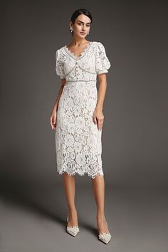 This lace crochet V-neckline midi dress will fill any of your little white dress needs, from your bridal shower to your after party. The textured lace overlay, accented with thick embroidery that outlines the lace’s blooms. Also features puff sleeves and delicate scalloped eyelash lace hem. The rhinestone trim and buttons adds an extra glitz and glam. No Stretch Medium Weight Size runs small,recommend one size up Fabric: 100% Polyester,Lining: 100% Polyester Model is 174cm/5'7" tall, 81cm/32" bust, 61cm/24" waist and 90cm/35" hip and wears a size S. Care Instruction: Hand Wash, Do not bleach, Dry flat in shade, Iron cool (max 110â„?, Dry clean, tetrachloroethylene(PCE) only.Please note: The images represent actual product though color of the image and product may slightly differ. This item Thick Embroidery, Modest Midi Dress, Vintage Dress Design, Little White Dress, Cap Dress, Rhinestone Trim, Korean Dress, Lace Crochet, Lace Hem