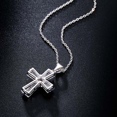 Love the New Elegant Cubic Zirconia Cross Necklace? Sometimes You Never Know The True Value Of A Moment Until It Becomes A Memory. And then you have this beautiful piece of jewelry to remind you of that special moment wherever you go. When was the last time you treated yourself to a lovely gift that reminds you of the most important events in your life? Carry your cross every day and remember what true love looks like. The New Elegant Cubic Zirconia Cross Necklace is carefully crafted with coppe Elegant Cross Jewelry As Gift For Her, Crystal Cross Clavicle Chain Jewelry, Fine Jewelry Cubic Zirconia For Anniversary Gift, Crystal Clavicle Chain With Cross Shape, Crystal Cross Clavicle Chain, Fine Jewelry Cubic Zirconia For Anniversary, Fine Cubic Zirconia Jewelry For Anniversary, Fine Jewelry Cross Necklace For Gift, Crystal Cross Pendant Clavicle Chain