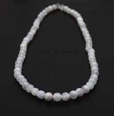 Product Details : ITEM : MOONSTONE BEADED NECKLACE Item Code : DGC1981 Gemstone Name : RAINBOW MOONSTONE Chain Style : BEADED Beads Shape : SMOOTH ROUND Beads Size : 7-7.5 mm Approx Length : 18 INCH WITH LOBSTER CLASP Weight : 175 Cts. Approx Customization : **Available** Please Feel Free To Contact If You Have Any Query. White Round Pearl Necklace With Natural Stones, White Pearl Necklace With Natural Stones, Moonstone Beaded Necklace For Gift, Faceted Moonstone Round Bead Necklaces, Moonstone Round Beads Jewelry, Moonstone Necklace With Faceted Beads For Gift, White Moon-shaped Necklace With Natural Stones, Moonstone Gemstone Beads Necklaces, Moonstone Round Beads Jewelry For Healing