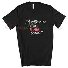 I'd Rather Be At a P!nk Concert T-Shirt  P!nk Tee T-Shirt Brand: Bella+Canvas -4.2 oz., 100% airlume combed and ringspun cotton -Shoulder taping -Side-seamed -Retail fit -Pre-shrunk -Unisex sizing - For the best fit, we recommend that you compare the measurements given on our size chart to the measurements of your most comfortable tee. All shirts are made to order therefore we do not accept returns/exchanges. P!nk Pink summer carnival 2023 shirt #Trustfall #PinkTee  #TheSingerPink #FanArtLogo #ConcertMerchandise #SummerCarnivalTour #TrustfallAlbum #NotDanceAgain #GiftForHimOrHer #IdRatherBeAtA #MusicT-Shirt #FunnyConcertTee #GiftForFriend #LiveMusicTshirt #RockAndRollBand #Pink #Aleciabethmoore #Aleciamoore #pinktour #pinktour2023 #pinklive2023 #summercarnival #summercarnivaltour #summerca Pink Punk T-shirt With Letter Print, Pink Punk T-shirt For Summer, Pink Kpop T-shirt For Summer, Band Merch Slogan Tops For Concerts, Band Merch Tops With Slogan For Concert, Pink Punk Style Summer T-shirt, Kpop Style Cotton T-shirt For Concerts, Punk Pink T-shirt With Letter Print, Pink Screen Print Top For Concert