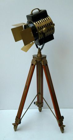 an old fashioned camera on a tripod