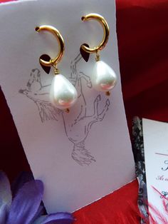 Pearls are timeless. These are South Sea Shell Pearls with gold-plated hoop leverbacks, gold-filled earwires or leverbacks, and/or sterling silver earwires or leverbacks. They look perfect with ANYTHING - even pajamas. SS is Sterling Silver, GF is Gold Filled, LB is Leverback, and EW is Earwire. They hang about 1-1/4 inches long. The pearls are beautiful, and I also have them in a very light pink pearl. The champagne pearl version is glass. If you do not have pierced ears, I have very nice clip- Classic Clip-on Hoop Earrings As Gift, Small Hoop Clip-on Earrings For Gift, Elegant Adjustable Hypoallergenic Huggie Earrings, Elegant Hypoallergenic Huggie Teardrop Earrings, Elegant Teardrop Huggie Earrings With Lever Back, Elegant Clip-on Huggie Earrings For Gift, Elegant Clip-on Huggie Earrings As Gift, Elegant Adjustable Huggie Earrings For Anniversary, Classic Handmade Teardrop Hoop Earrings