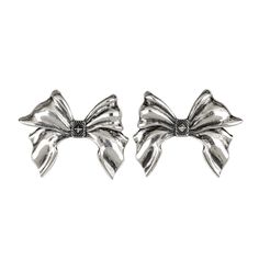 Our Bow Earrings expertly crafted in gleaming silver, emulate the elegance of a real bow. Inspired by the intricate details of the Pregomesh, these earrings feature crisply sculpted elements, capturing the essence of coquettish charm with a touch of boldness. Classic Bow Earrings For Anniversary, Elegant Bow Tie Earrings For Wedding, White Gold Metal Earrings For Evening, Elegant Bow Earrings For Formal Occasions, Elegant Jewelry With Decorative Bow For Anniversary, Silver Metal Clip-on Earrings For Formal Occasions, Elegant Formal Earrings With Bow, Wedding Bow Tie Earrings, Formal Silver Metal Earrings