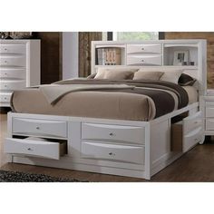 a white bed with drawers underneath it