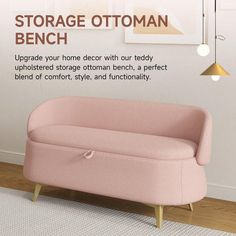 a pink couch sitting on top of a hard wood floor next to a white wall