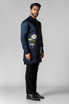 A navy peony long neheru jacket embroired with resham and applique work highlighted with chid work. The jacket is paired with a kurta of same color with pintuck detailing.

Size Chart For Men





	
	
					Men's Size Chart
		

		
		
						
				Size Chart For Men
				Custom Size Measurement Guide
			
			
				
				
				Custom Size Measurement Guide
1. Take your measurements at ease…don’t hold your breath!
2. Be a little generous with the measurements. It’s always easier to take the garment in than Winter Embroidered Sherwani With Straight Kurta, Traditional Long Sleeve Wear With Embroidery, Festive Kurta With Floral Embroidery And Stand Collar, Designer Embroidered Bandhgala With Straight Kurta, Formal Nehru Jacket With Floral Embroidery And Straight Cut, Festive Stand Collar Kurta With Floral Embroidery, Formal Nehru Jacket With Floral Embroidery And Straight Fit, Fitted Kurta With Floral Embroidery For Fall, Formal Straight Nehru Jacket With Floral Embroidery